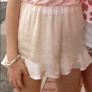 Silk cream shorts with ruffle on the side!